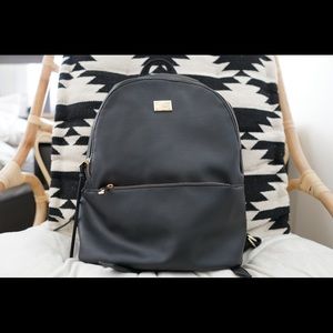 black faux leather book bag